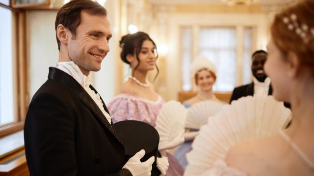 Gentleman talking to young lady