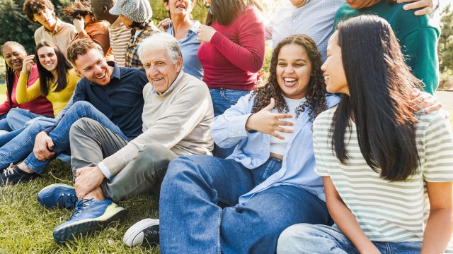 Group of multigenerational people smiling in front of camera – M