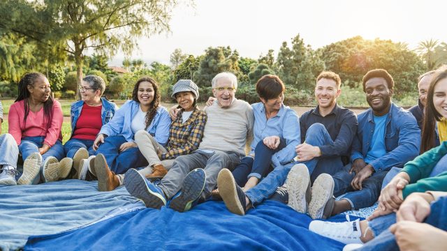 Group of multigenerational people smiling in front of camera – M