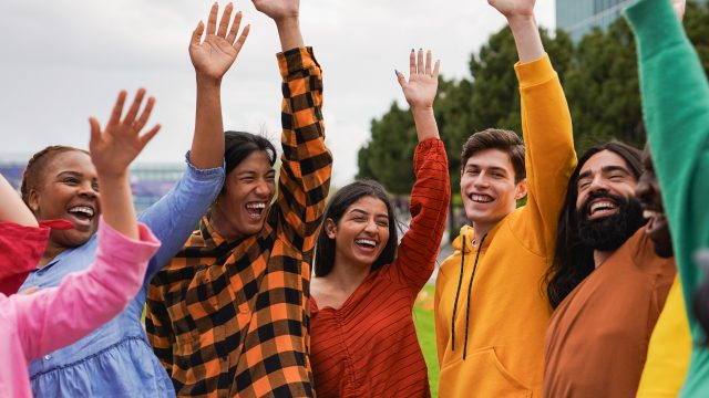 Group of multiracial university students celebrate success toget