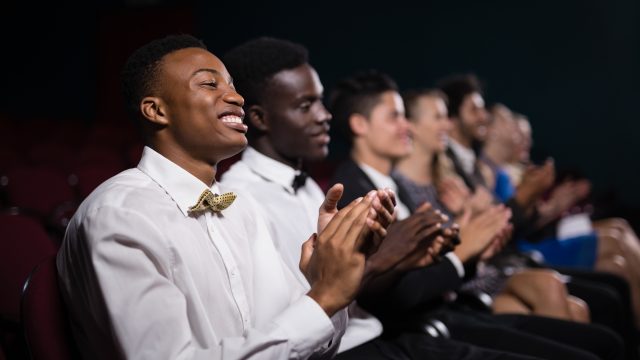 Group of people applauding