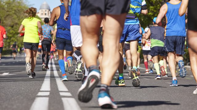 Marathon runners on the street. Healthy lifestyle. Athletes effo
