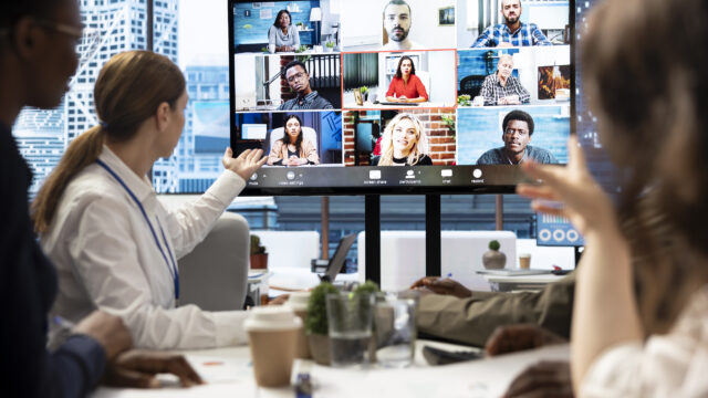Marketing team analyzing big data insights on online videoconference
