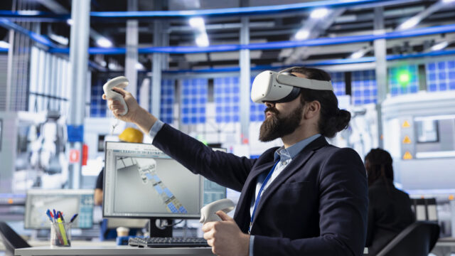 Photovoltaics factory engineer using VR gear to conduct machinery testing