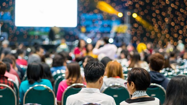 Rear view of Audience in the conference hall or seminar meeting