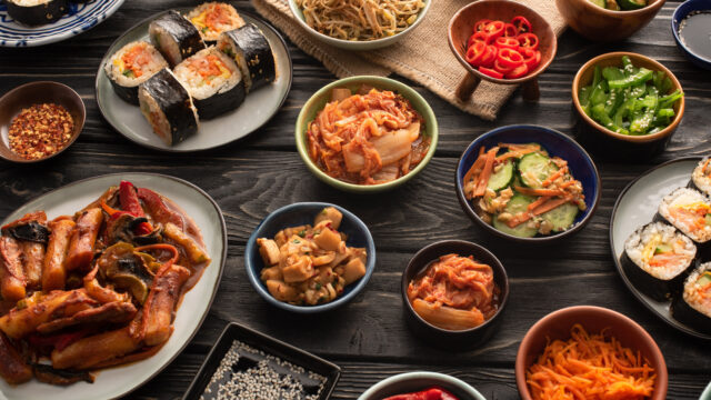 selective focus of traditional and tasty korean dishes on wooden surface