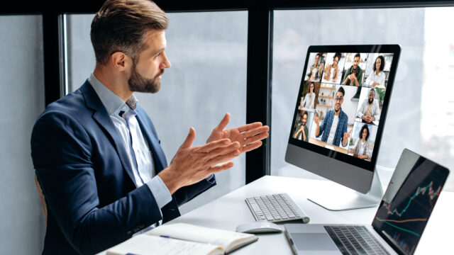 Side view at a successful man, company boss, stock investor, having financial brainstorm with group of multiracial people by video conference, discuss investments in the stock market, risks